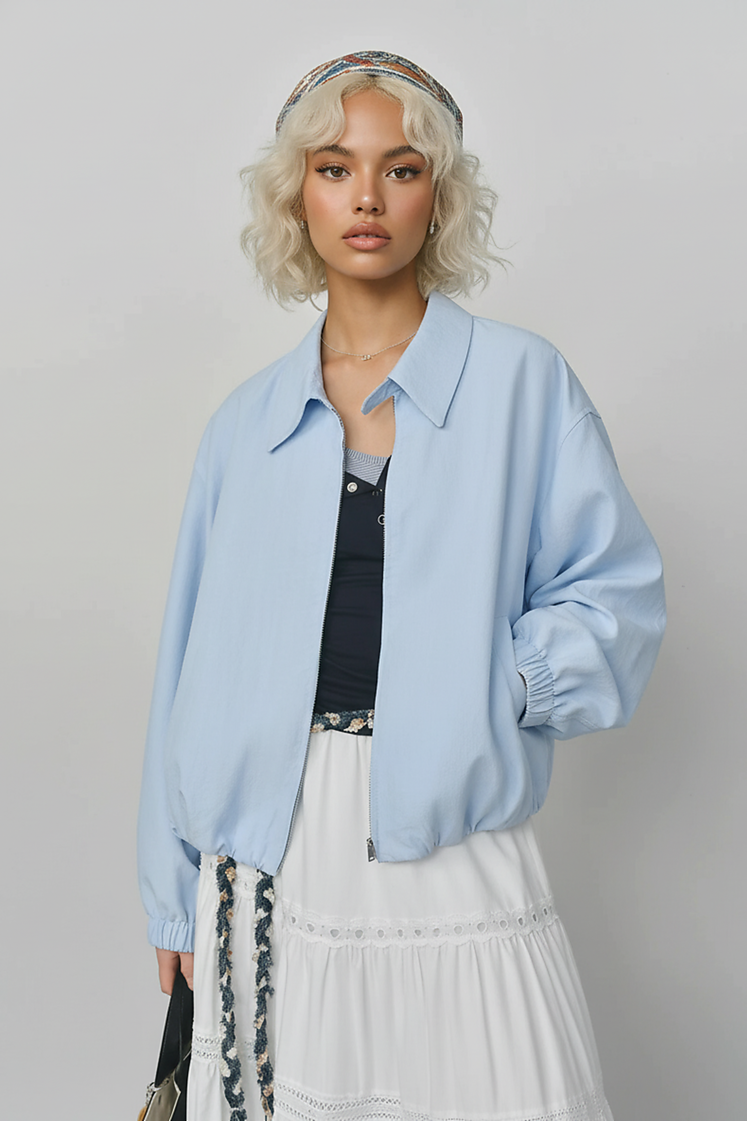 Beige short jacket, sleeve detail.