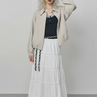 Beige short jacket, hem detail.