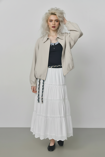 Beige short jacket, hem detail.