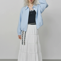 Beige short jacket, front view on model.