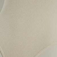 Ribbed jumpsuit fabric, close-up detail.