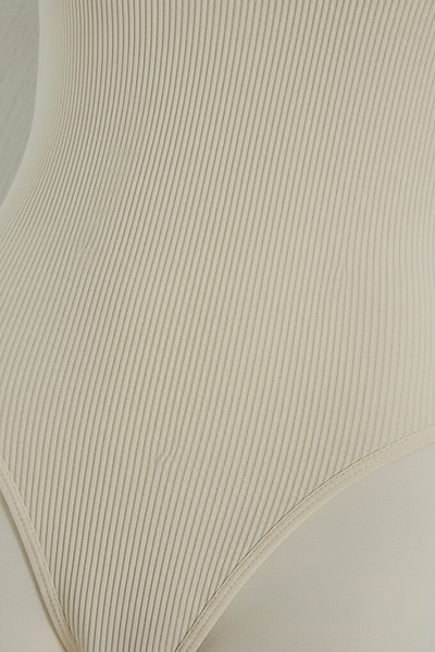 Ribbed jumpsuit fabric, close-up detail.