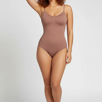 Spandex thong bodysuit, angled view on model.