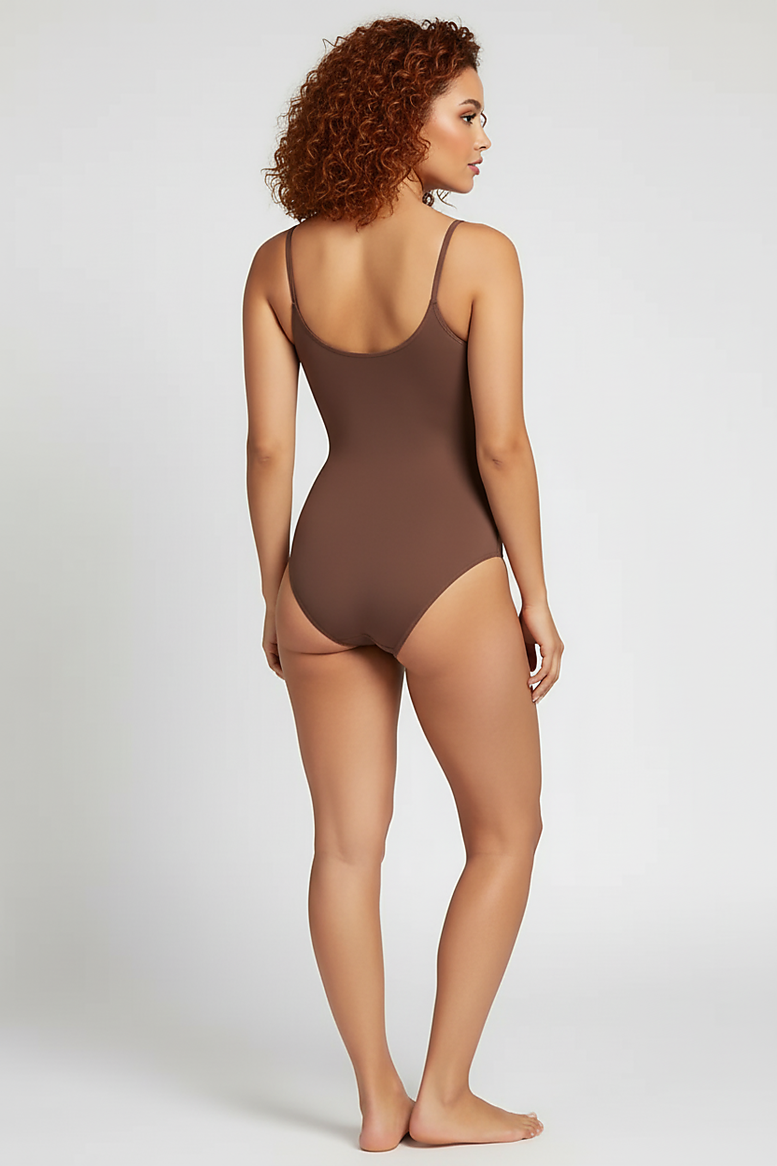 Spandex thong bodysuit, back view on model.