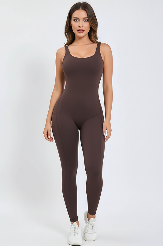 Black sports one-piece, side view on model.