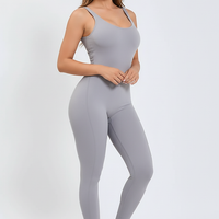 Black sports one-piece, 3/4 view on model.