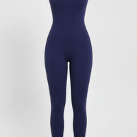 Black sports one-piece, dynamic pose on model.
