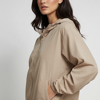 Orange transparent hooded jacket, back view on model.