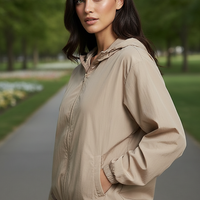 Orange transparent hooded jacket, zipper and hood detail.
