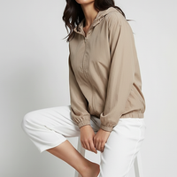 Orange transparent hooded jacket, front zipper detail.