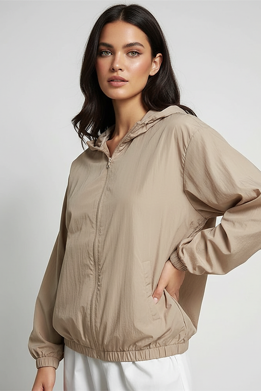 Orange transparent hooded jacket, front view on model.