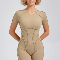 Black workout jumpsuit, alternate angle view on model.