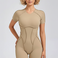 Black workout jumpsuit, alternate angle view on model.