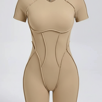 Black workout jumpsuit, alternate angle view on model.