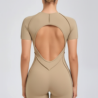 Black workout jumpsuit, back view on model.