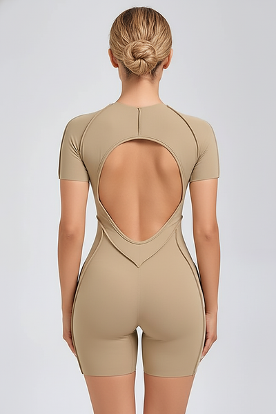 Black workout jumpsuit, back view on model.