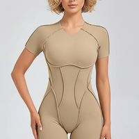 Black workout jumpsuit, front view on model.