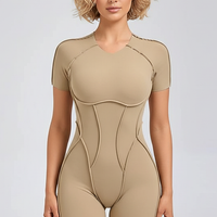 Black workout jumpsuit, front view on model.