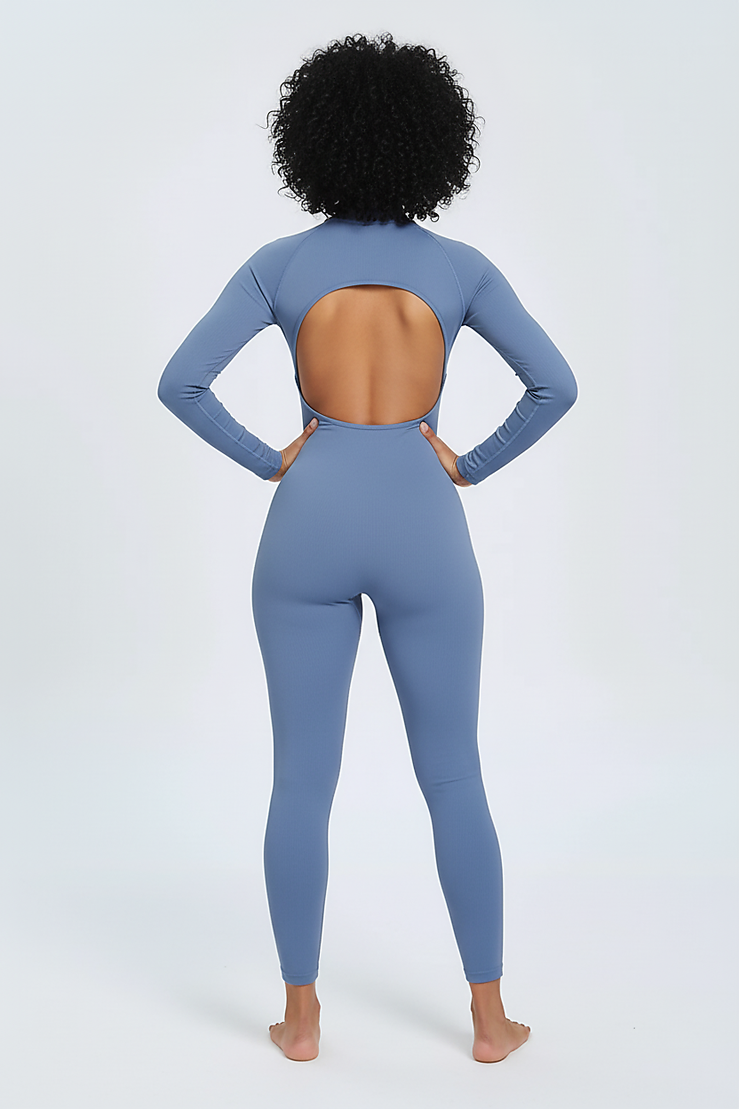 V-back sports jumpsuit, front view on model.