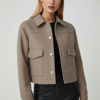 Solid long-sleeve jacket, close-up front view.