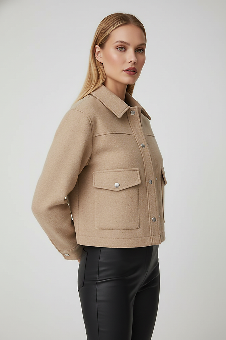 Solid long-sleeve jacket, close-up front view.