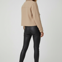 Women's solid long-sleeve jacket, front view on model.