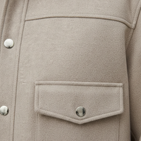 Solid long-sleeve jacket collar detail.