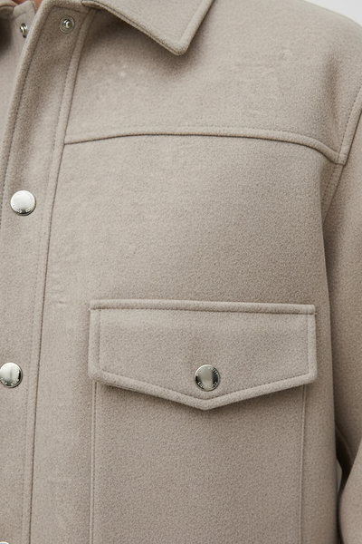 Solid long-sleeve jacket collar detail.