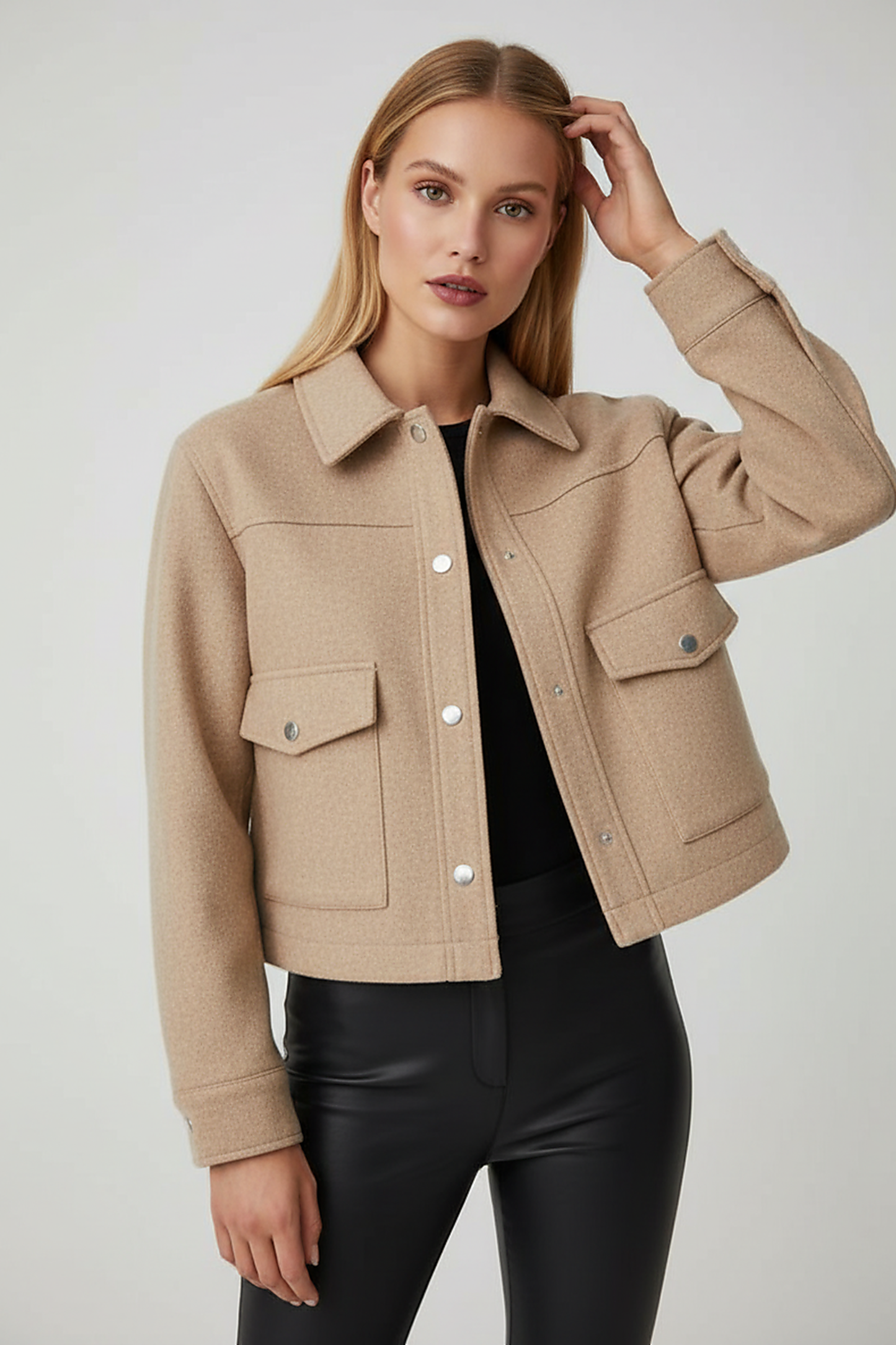 Solid long-sleeve jacket hem detail.