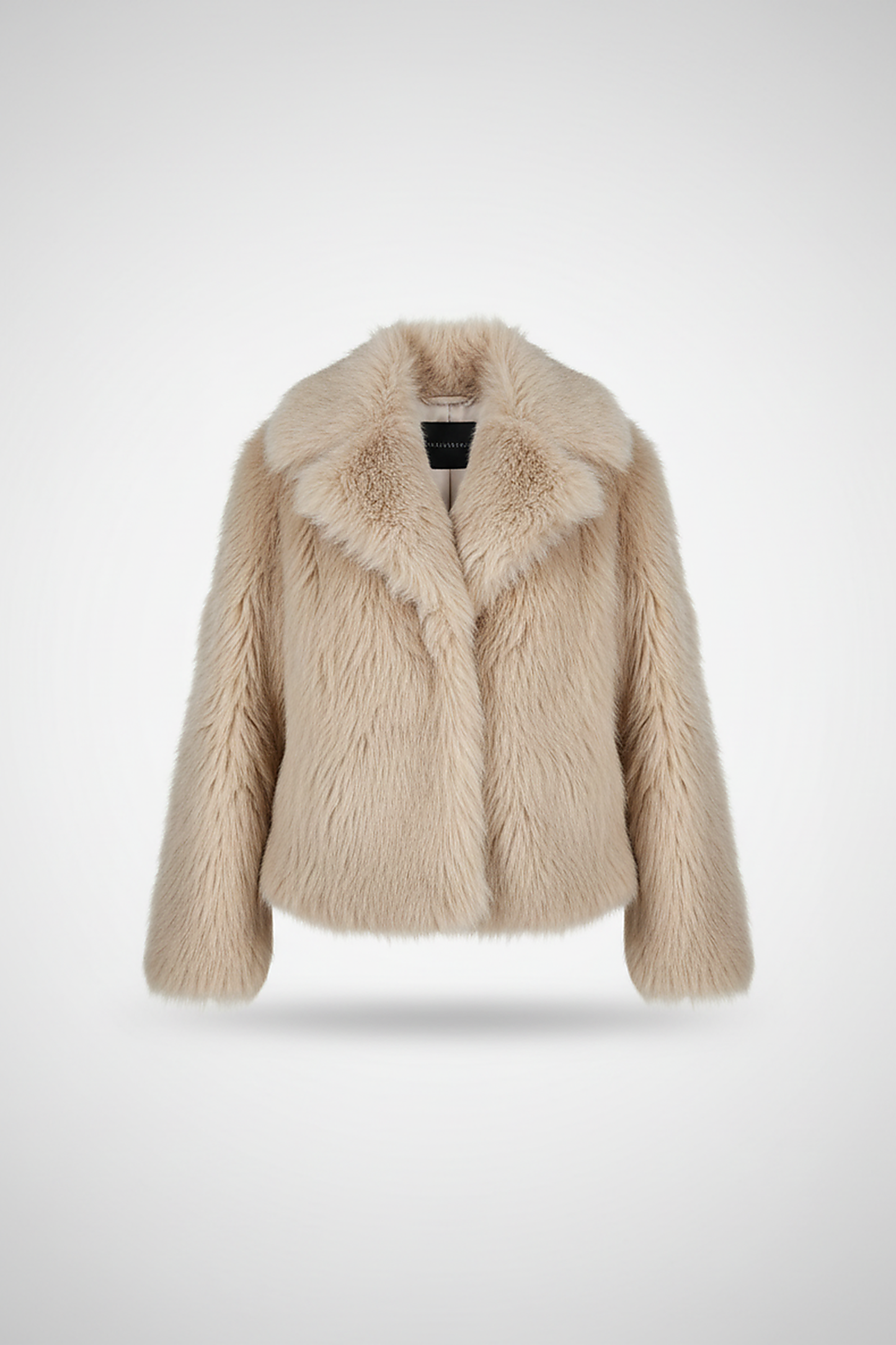 Cropped faux fur jacket, angled back view on model.