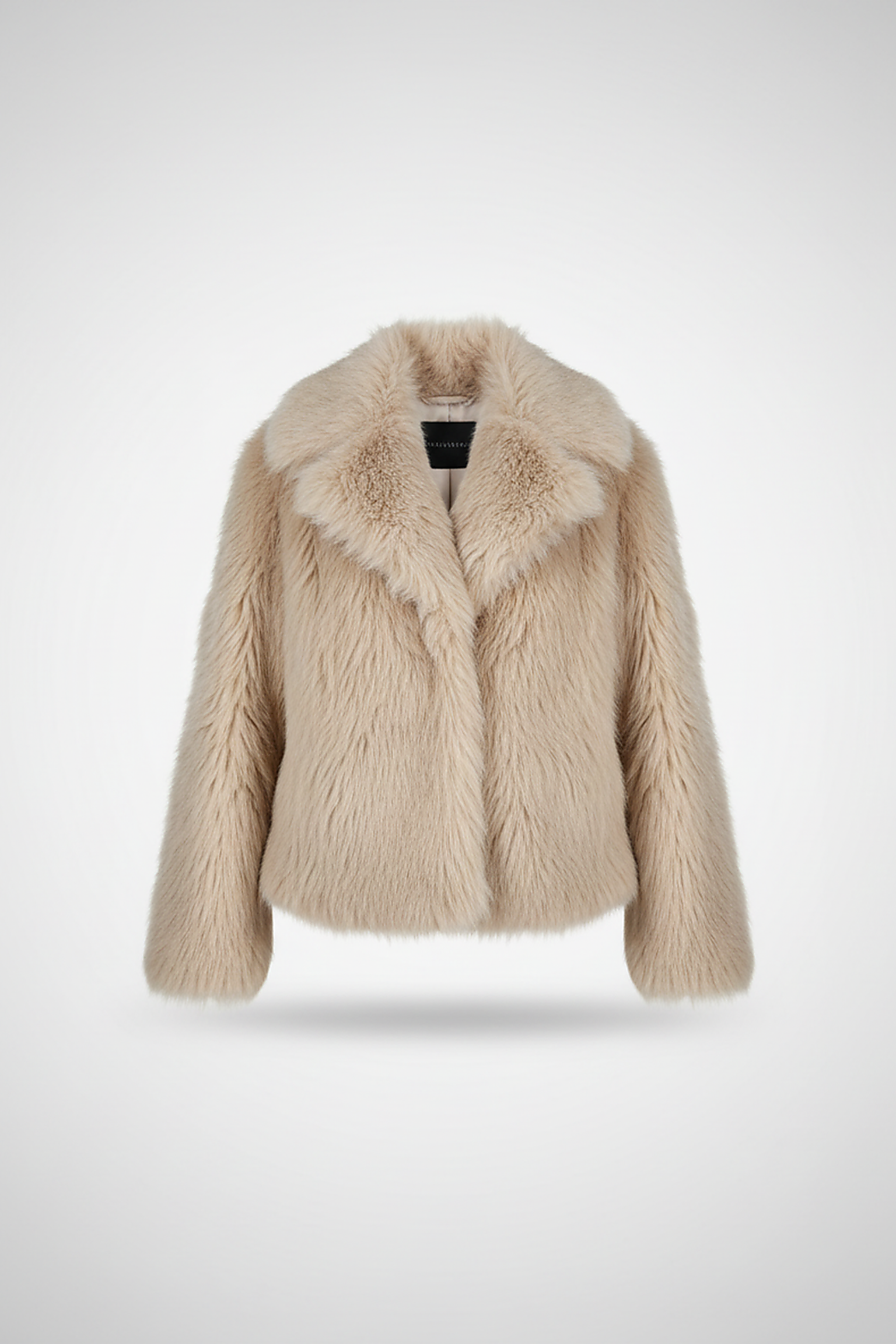 Cropped faux fur jacket, angled back view on model.