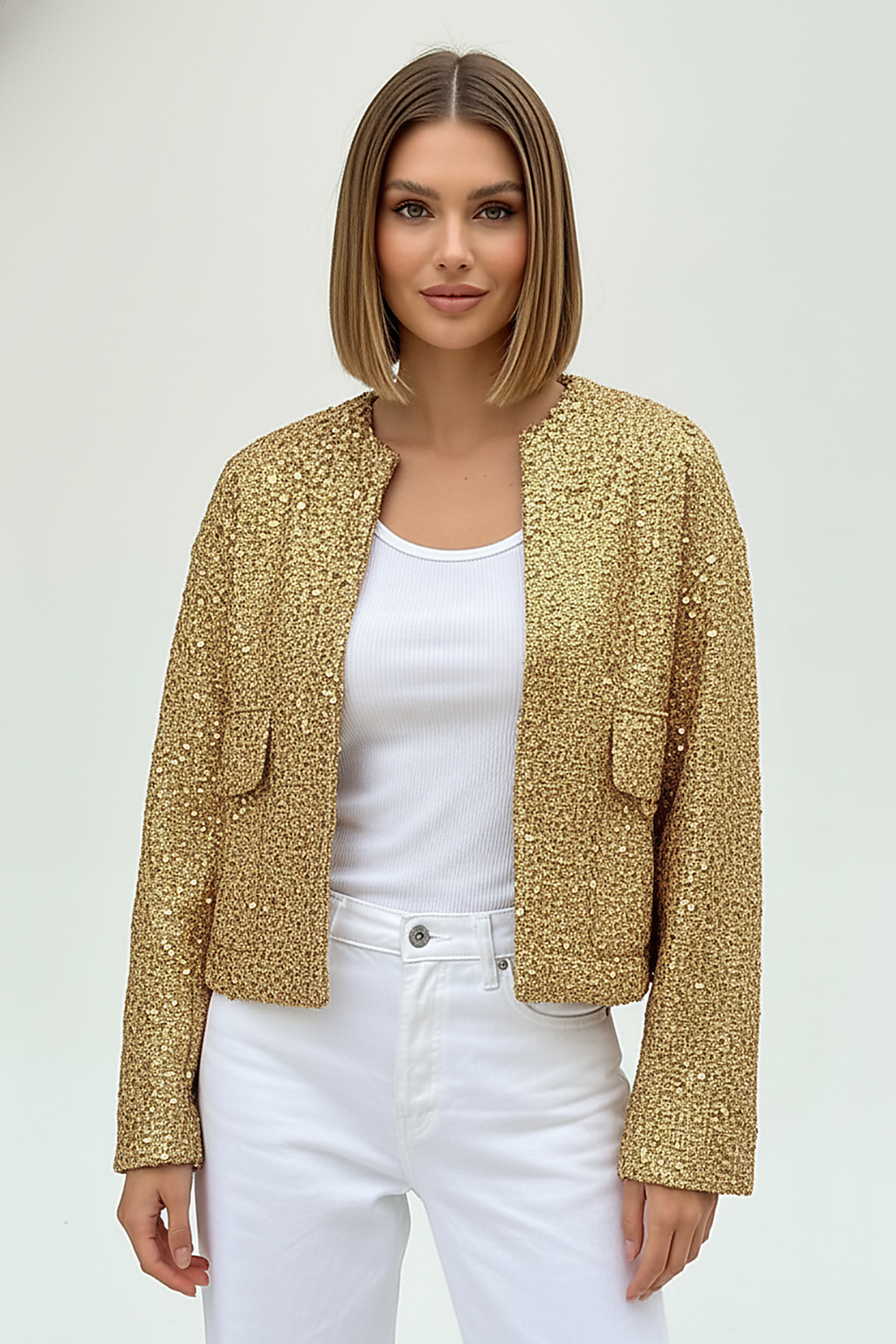 Gold sequin jacket, side view on model.