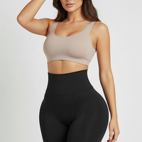 Black padded shapewear shorts, side view on model.