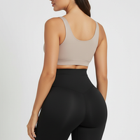 Black padded shapewear shorts, back view on model.