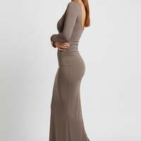 Elegant solid long sleeve backless maxi gown, front view on model.