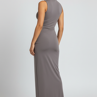 White elegant sleeveless high-slit turtleneck maxi dress, on model.