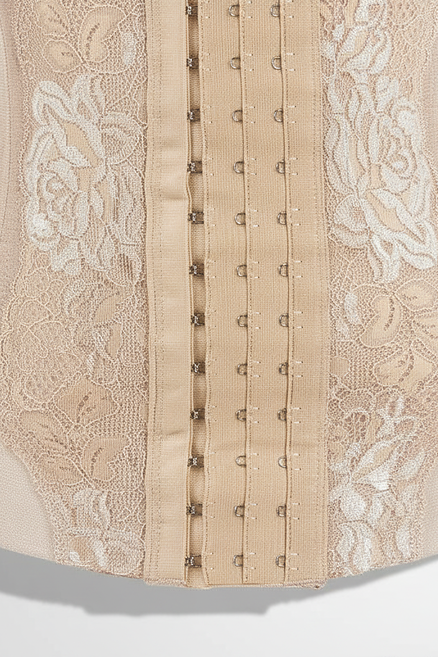 Mesh embroidered corset body shaper, close-up fabric detail.