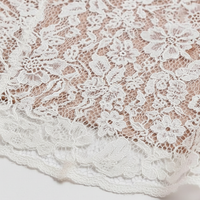 White lace long sleeve bodycon midi dress, front view on model.