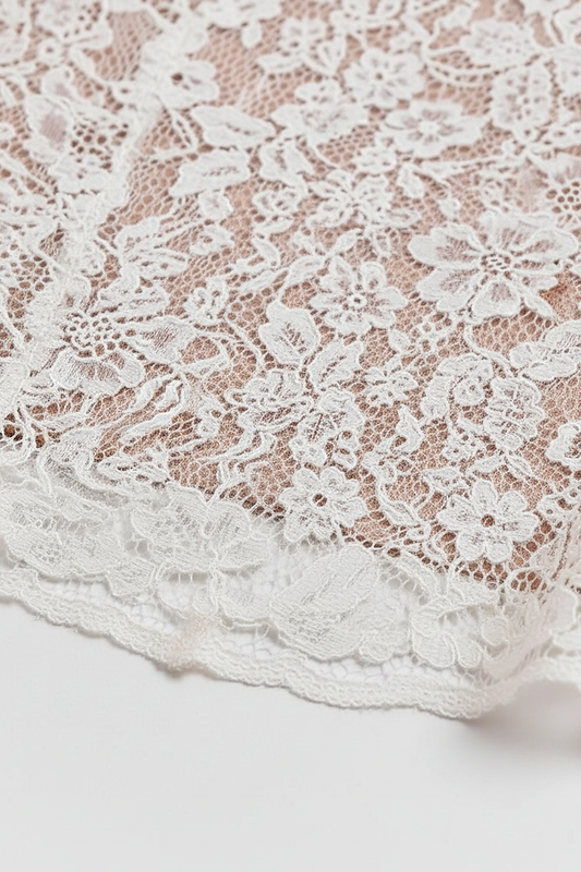 White lace long sleeve bodycon midi dress, front view on model.