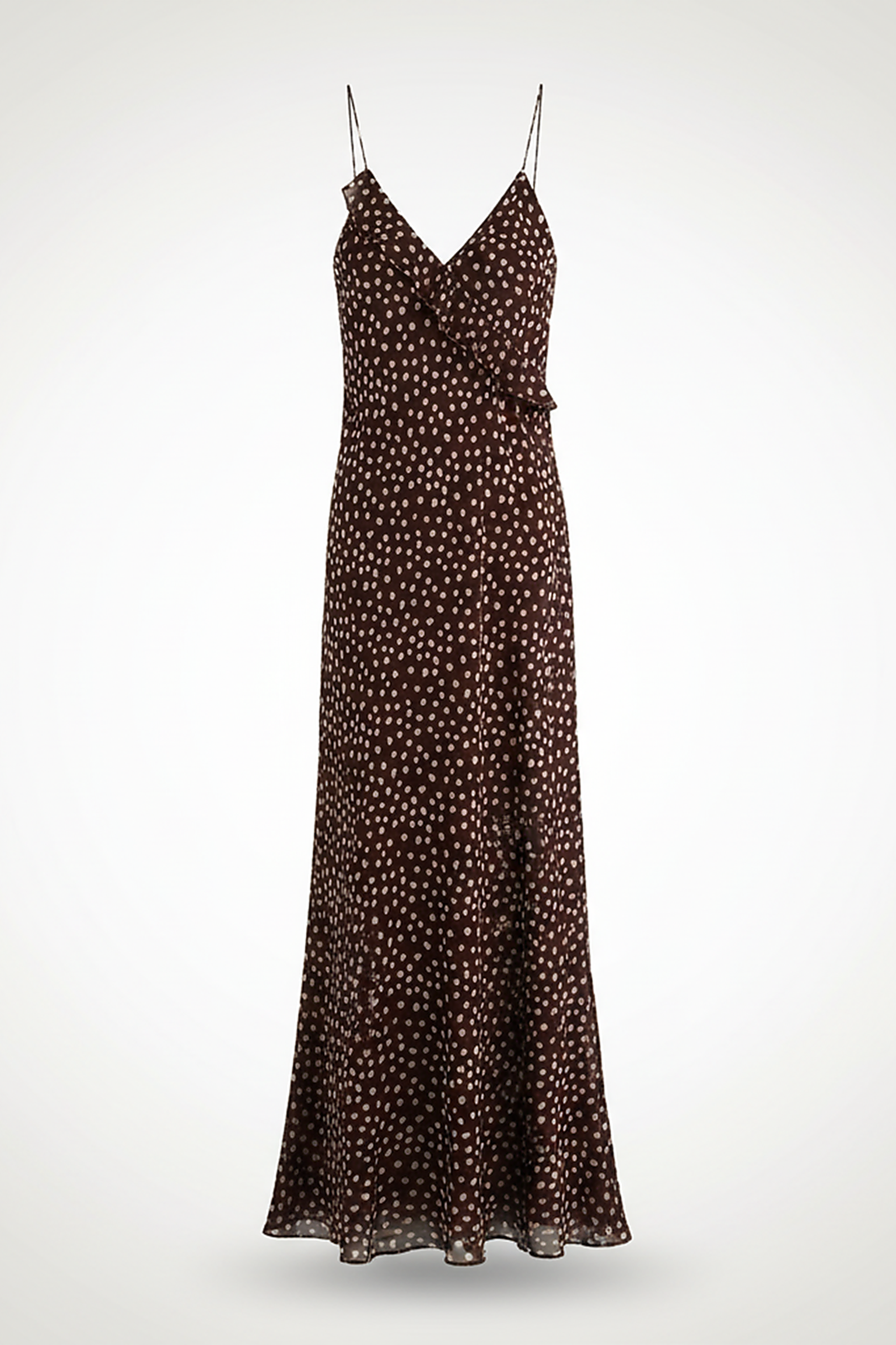 Flowy polka dot layered suspender sundress, front view on model.