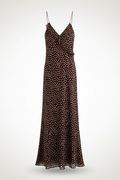 Flowy polka dot layered suspender sundress, front view on model.