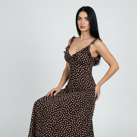 Simple polka dot sleeveless layered suspender dress, front view on model.