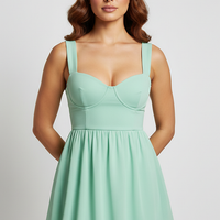 Solid color backless ruffle mini dress with cutouts, back view on model.