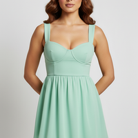 Solid color cutout ruffle backless mini dress, front view on model.