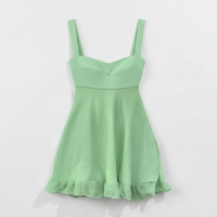 Solid color spaghetti strap cutout ruffle mini dress, front view on model.