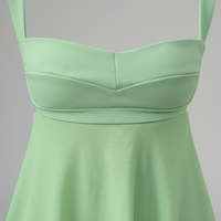 Solid color spaghetti strap cutout backless ruffle dress, front view on model.