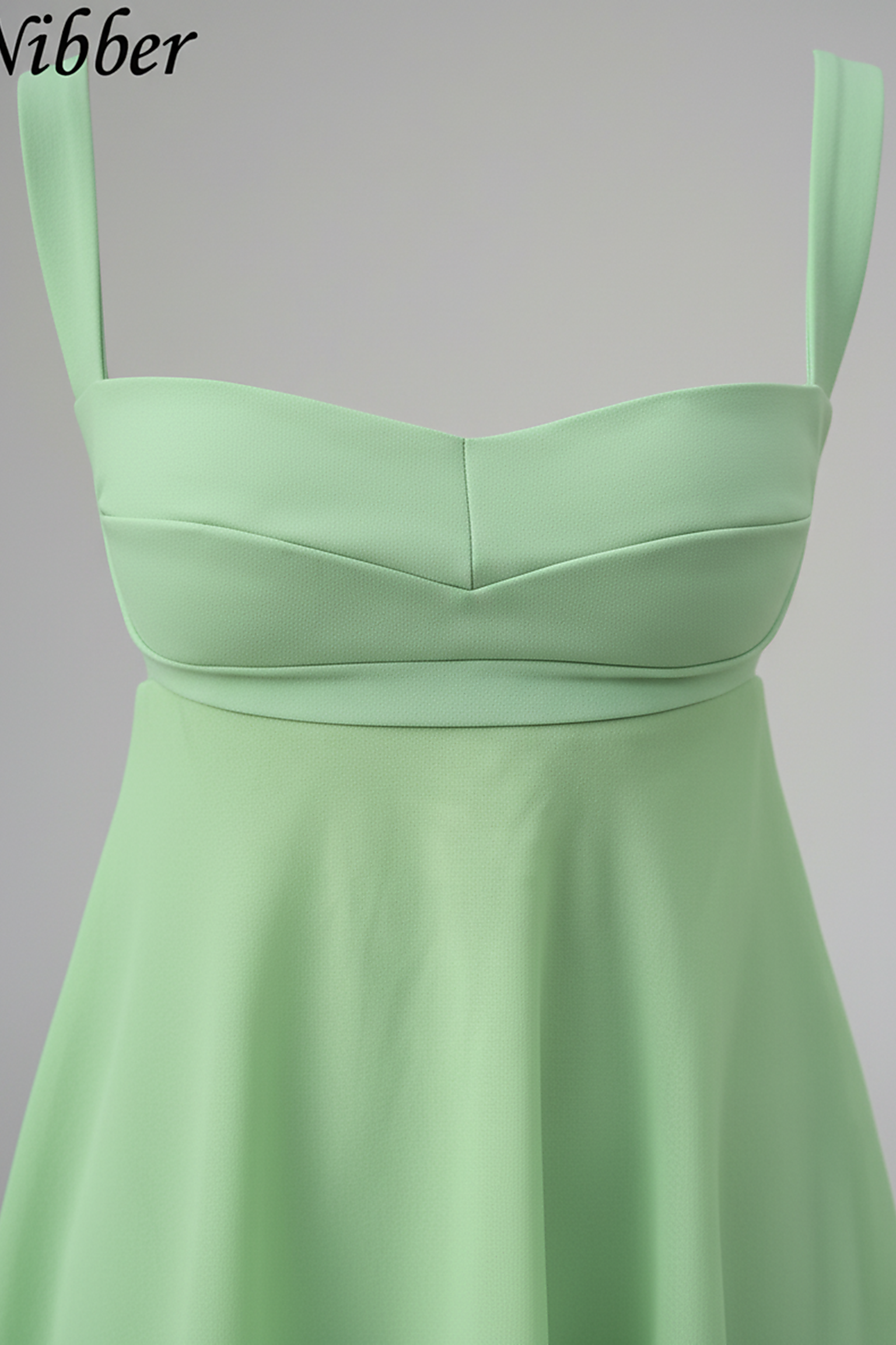 Solid color spaghetti strap cutout backless ruffle dress, front view on model.