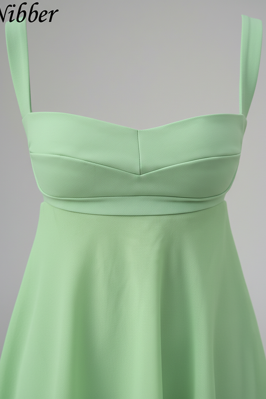 Solid color spaghetti strap cutout backless ruffle dress, front view on model.