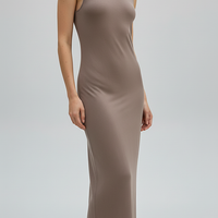 Brown sleeveless knitted dress, back view on model.