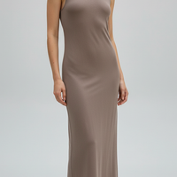 Brown sleeveless knitted dress, front view on model.